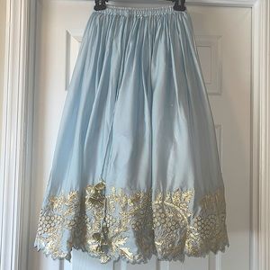 Light blue and gold hand embroidered 3 piece Indian or Pakistani lehenga set.